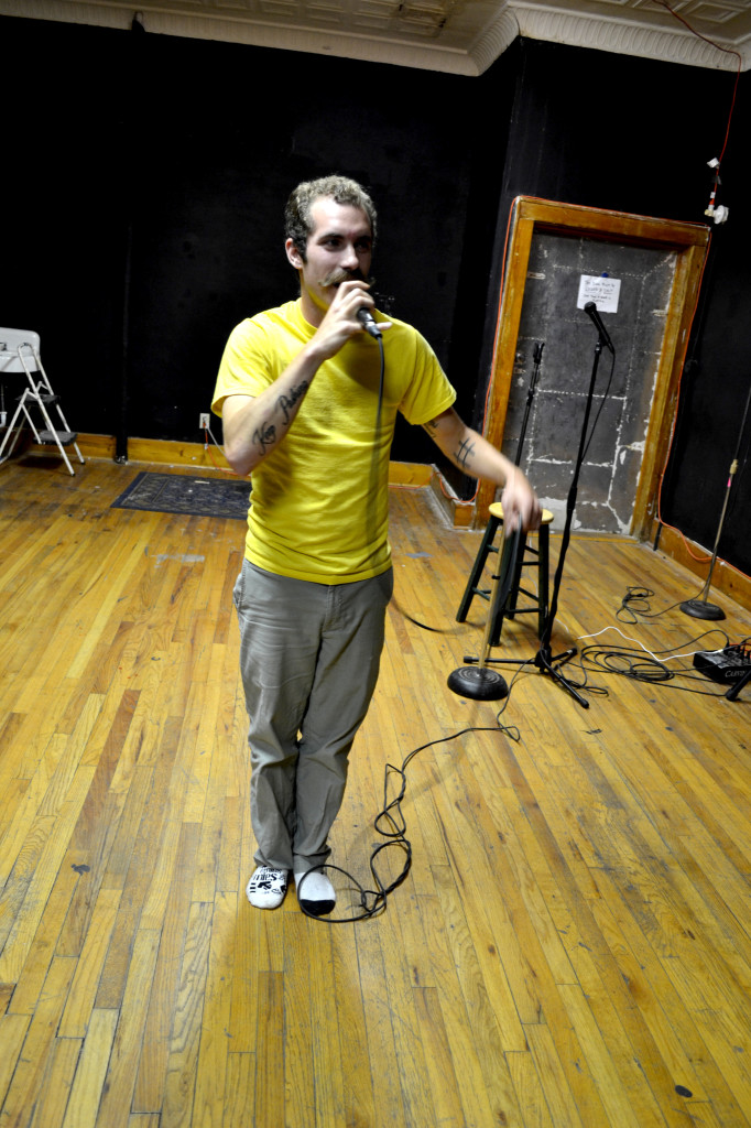 AllOne recites poetry at Badlands. Photo by Evan Bujold.