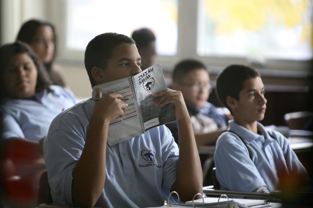 Students listening to a lecture inside a classroom in the Syracuse Academy of Science Charter School. Michael Davis Photo | Syracuse New Times