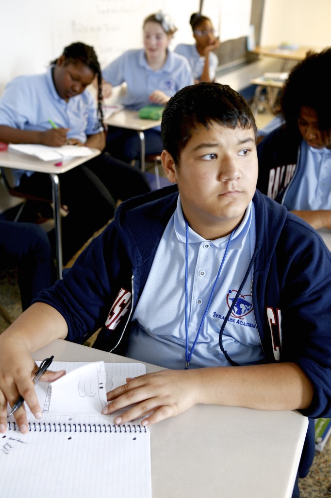 A student taking notes. Michael Davis Photo | Syracuse New Times