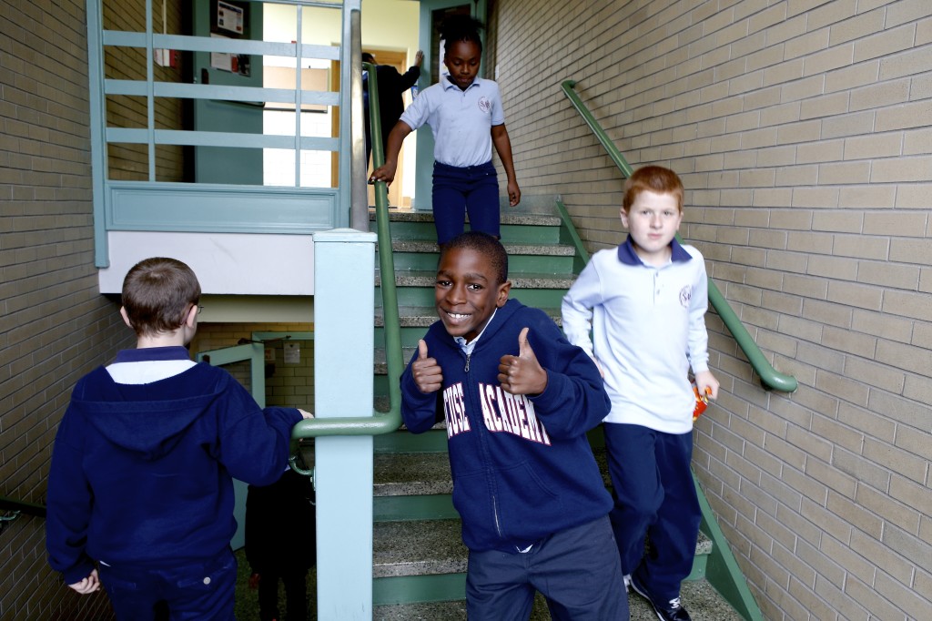 Students walking down a stairwell in the Syracuse  Michael Davis Photo | Syracuse New Times