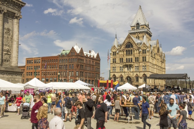 A wieshot of Clinton Square. Hundreds of people walk around to different tents to grab some grub.